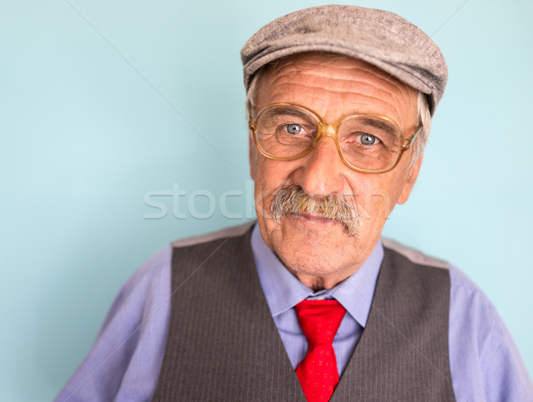 Portrait of a smiling and confident mature businessman with must Stock photo © zurijeta