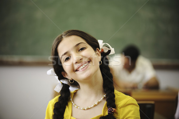 Beautiful little girl in classroom Stock photo © zurijeta