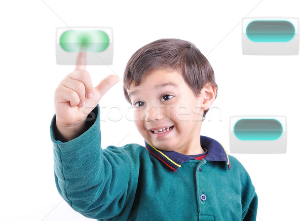 Little cute child pressing digital buttons on touchscreen, ideal for your concept Stock photo © zurijeta