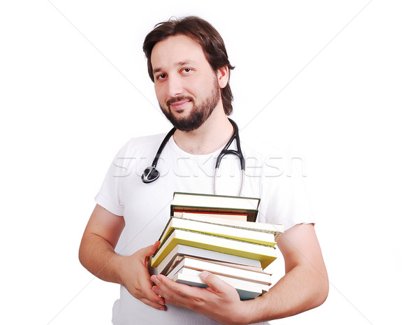 Jonge mannelijke arts boeken handen glimlach arts Stockfoto © zurijeta