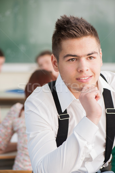 Handsome student with suspenders Stock photo © zurijeta