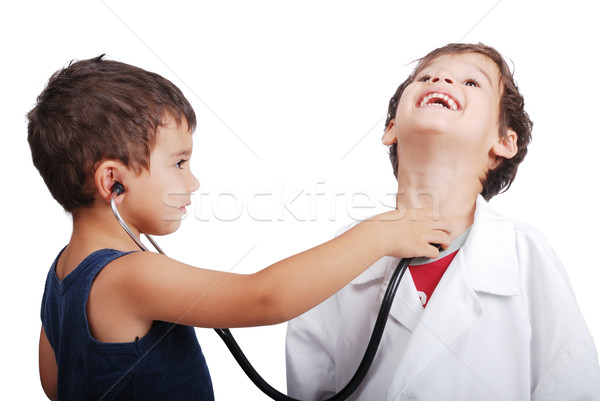 Doctor kid examining pulse to other kid Stock photo © zurijeta