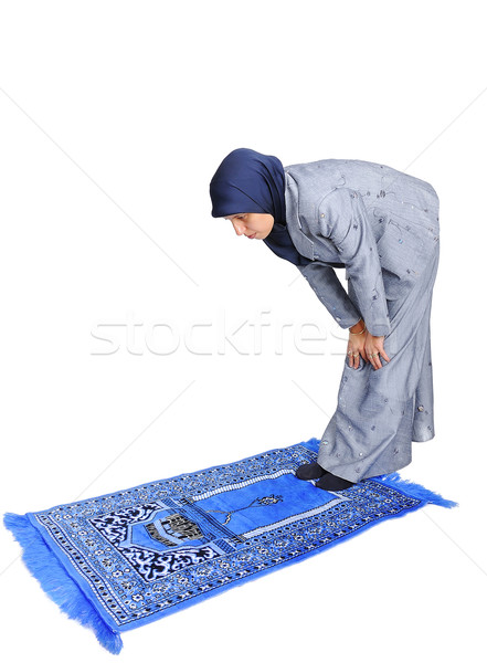 Young nice muslim female praying on traditional way Stock photo © zurijeta