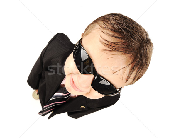 Adorable little kid wearing a suite and sunglasses Stock photo © zurijeta