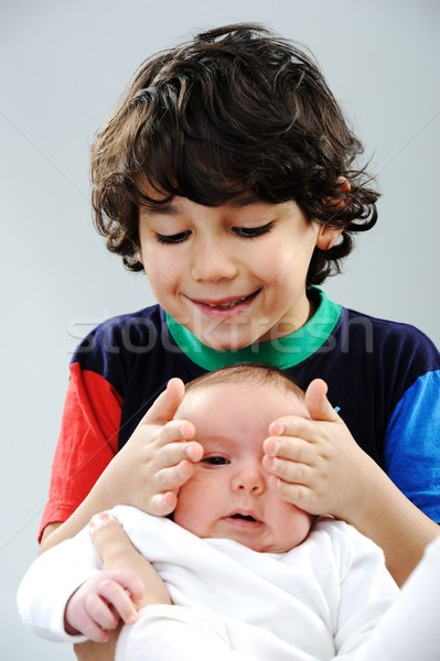 Little boy playing with his new baby brother Stock photo © zurijeta