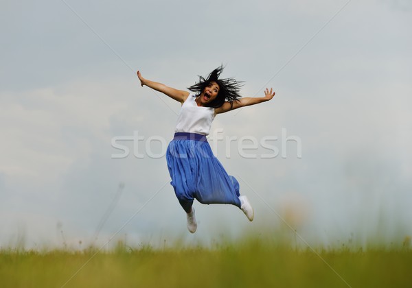 Young person having relaxed happy time on meadow in nature Stock photo © zurijeta