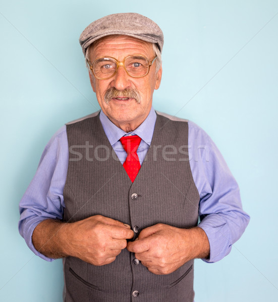 Portrait of a smiling and confident mature businessman with must Stock photo © zurijeta