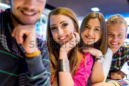 Authentic image of young real people having good time together Stock photo © zurijeta