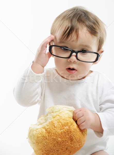 Baby eating bun bread Stock photo © zurijeta