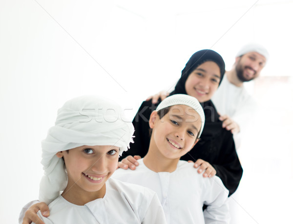 Happy Arabic family having fun time standing in line at home Stock photo © zurijeta