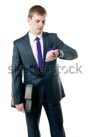 Jonge zakenman pak naar horloge geïsoleerd Stockfoto © zybr78